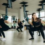Cross training class of women doing deadlifts